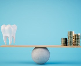 A 3D illustration of a tooth and stacks of coins balanced on a scale